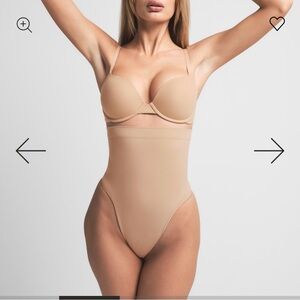 NWT Skims seamless sculpt control thong high waisted. Size S. Color Sand